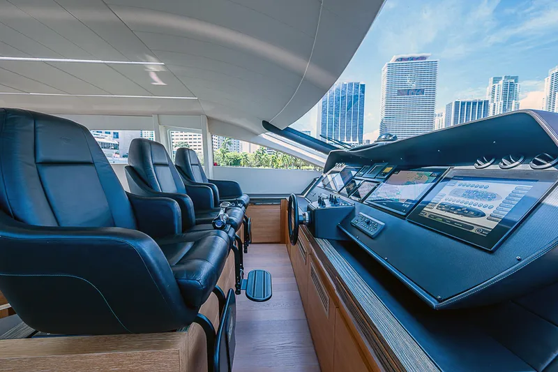 Scissortail II Yacht Photos Pics Luxurious 2013 Pershing 92 Express yacht cockpit with leather seats and modern controls.