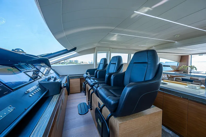Scissortail II Yacht Photos Pics Luxurious interior of 2013 Pershing 92 Express yacht with sleek black leather seating.