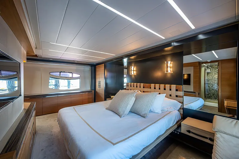 Scissortail II Yacht Photos Pics Luxurious bedroom interior of 2013 Pershing 92 Express yacht with modern design elements.