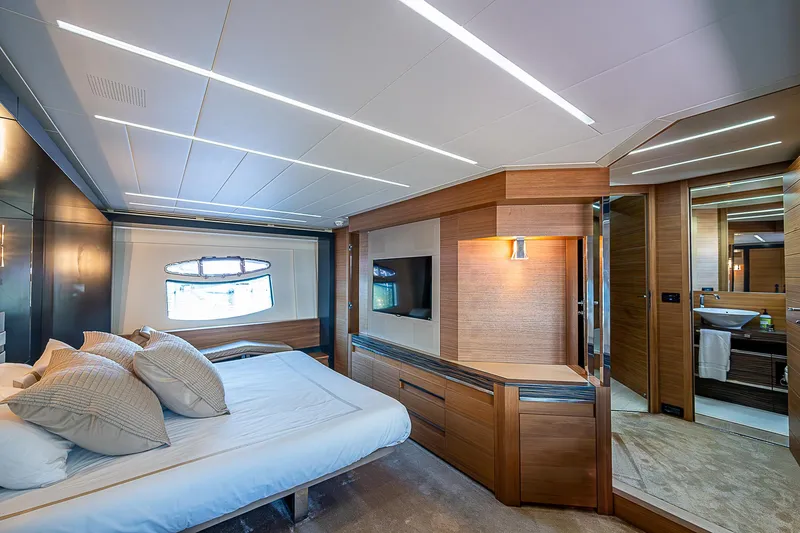Scissortail II Yacht Photos Pics Luxurious bedroom interior of 2013 Pershing 92 Express yacht with modern design and elegant furnishings.