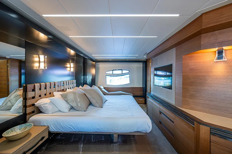 Scissortail II Yacht Photos Pics Luxurious bedroom interior of 2013 Pershing 92 Express yacht with modern design elements.