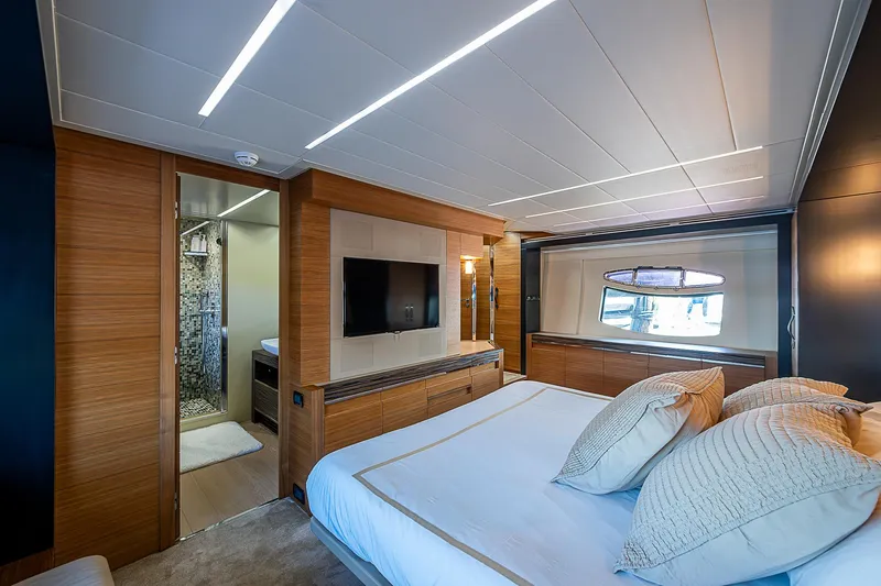 Scissortail II Yacht Photos Pics Luxurious bedroom interior of 2013 Pershing 92 Express yacht with modern design and large window.