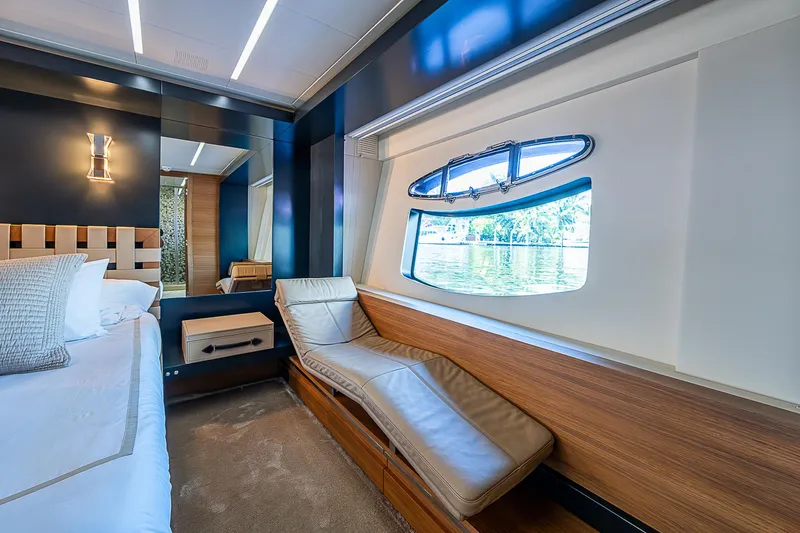 Scissortail II Yacht Photos Pics Luxurious interior of 2013 Pershing 92 Express yacht with elegant chaise lounge and scenic window view.