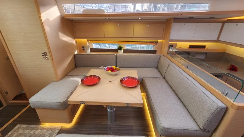 New Stock Boat - Available Now Yacht Photos Pics Luxurious interior of 2023 Dufour 530 yacht with modern seating and dining area.