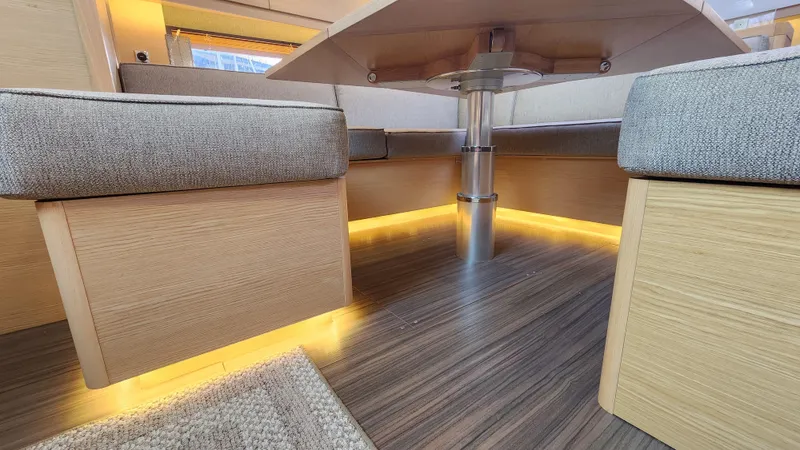 New Stock Boat - Available Now Yacht Photos Pics Interior of 2023 Dufour 530 yacht with modern seating and ambient lighting.