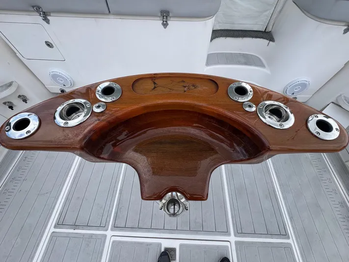  Yacht Photos Pics Wooden helm station on a 2005 Cabo 40 Hardtop Express boat.