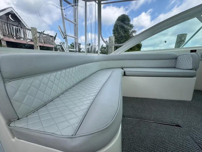  Yacht Photos Pics Luxurious interior seating of 2005 Cabo 40 Hardtop Express boat, featuring quilted upholstery.