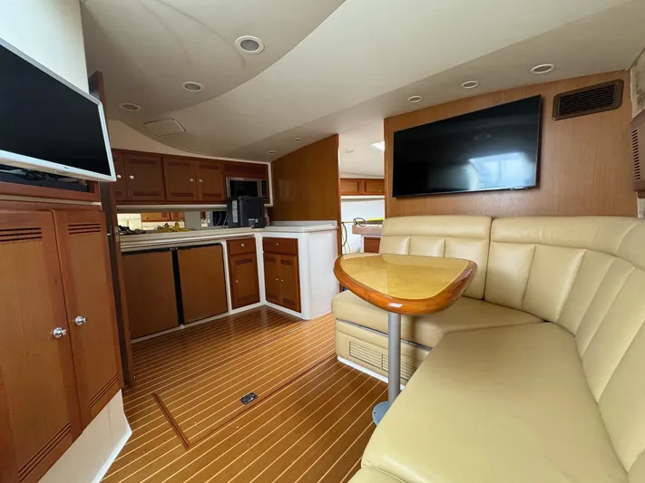  Yacht Photos Pics Luxurious interior of 2005 Cabo 40 Hardtop Express yacht with leather seating and modern amenities.