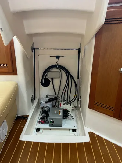  Yacht Photos Pics 2005 Cabo 40 Hardtop Express interior compartment with wiring and equipment.