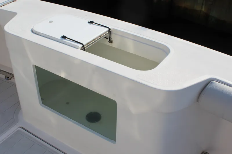  Yacht Photos Pics Livewell on 2005 Cabo 40 Hardtop Express boat, featuring a transparent viewing window.