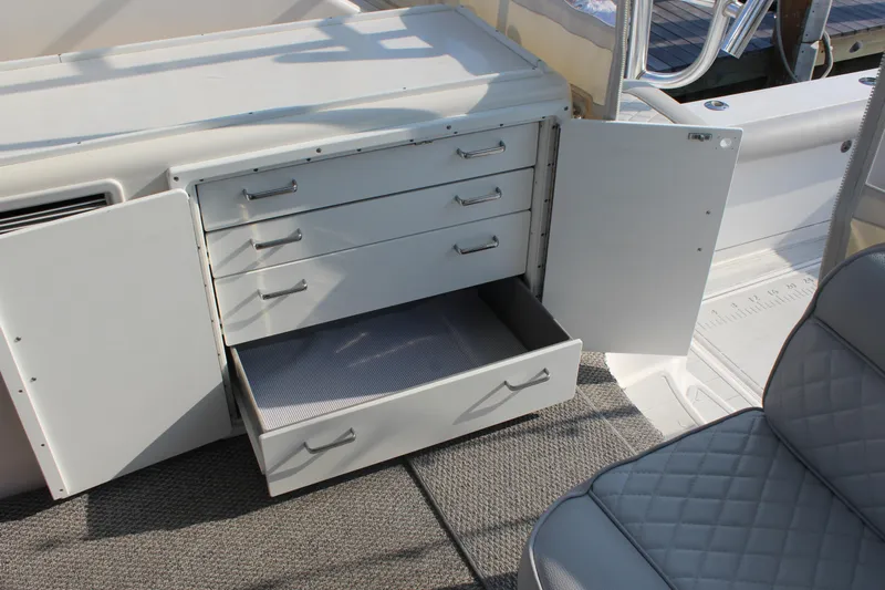  Yacht Photos Pics Open storage cabinet with drawers on a 2005 Cabo 40 Hardtop Express boat.