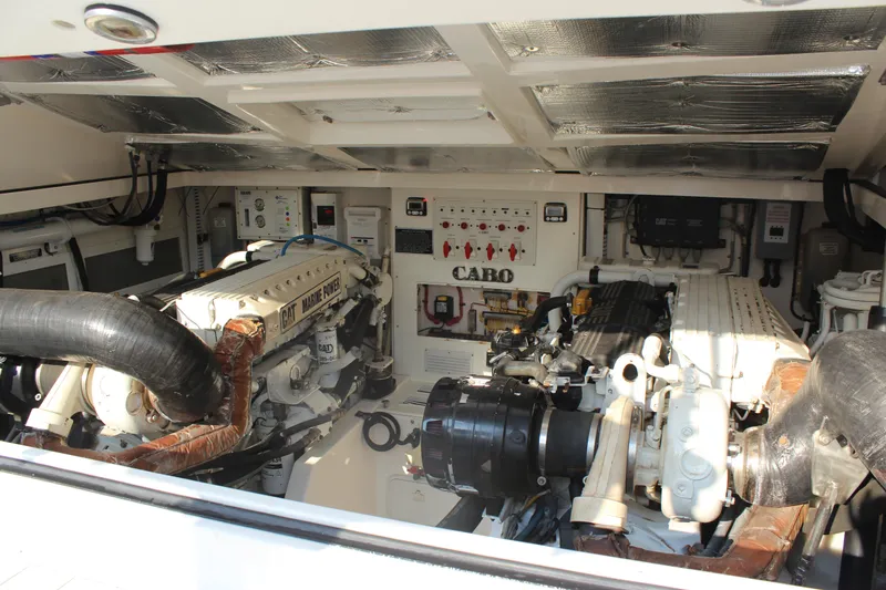  Yacht Photos Pics Engine room of 2005 Cabo 40 Hardtop Express with CAT marine engines.