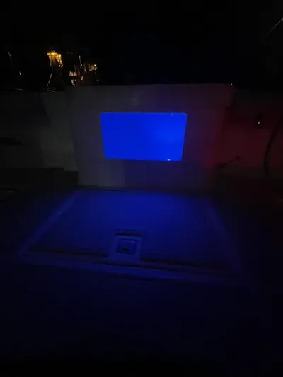  Yacht Photos Pics 2005 Cabo 40 Hardtop Express boat interior with blue ambient lighting at night.