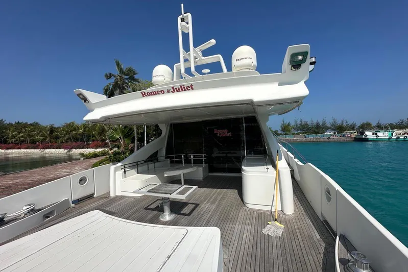 Romeo & Juliet Yacht Photos Pics 2009 Azimut 86S yacht "Romeo & Juliet" docked by turquoise water and lush greenery.