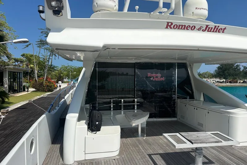 Romeo & Juliet Yacht Photos Pics Luxury Azimut 86S yacht "Romeo & Juliet" docked, featuring sleek design and spacious deck.
