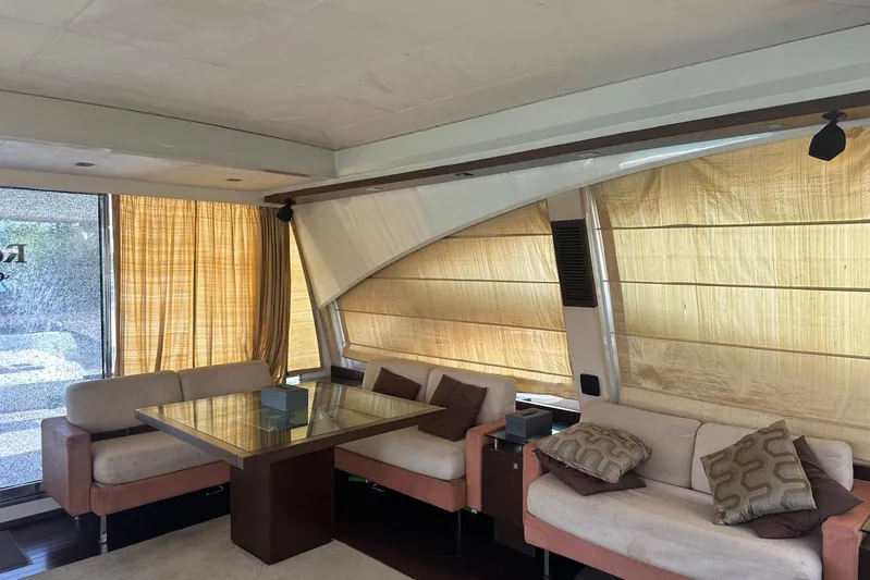 Romeo & Juliet Yacht Photos Pics Luxurious interior of 2009 Azimut 86S yacht with elegant seating and large windows.