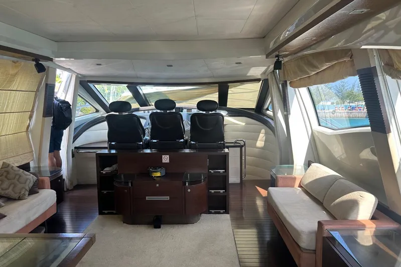 Romeo & Juliet Yacht Photos Pics Interior of 2009 Azimut 86S yacht with luxurious seating and helm station.