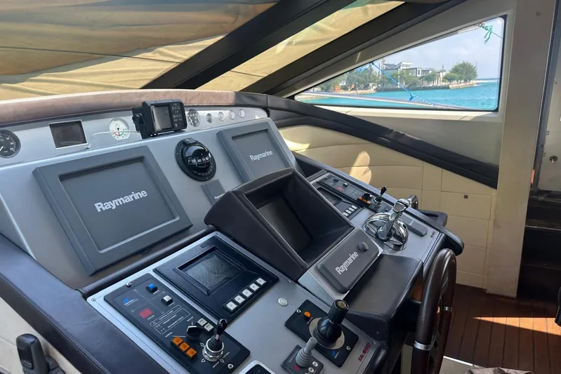 Romeo & Juliet Yacht Photos Pics Cockpit of 2009 Azimut 86S yacht with Raymarine navigation equipment and ocean view.
