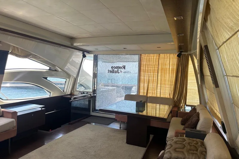 Romeo & Juliet Yacht Photos Pics Luxurious interior of 2009 Azimut 86S yacht with elegant seating and panoramic windows.