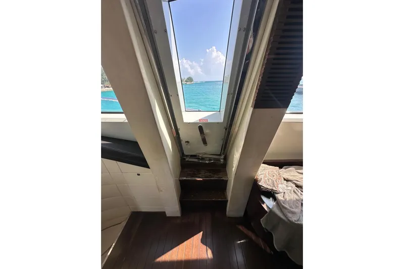 Romeo & Juliet Yacht Photos Pics Interior view of 2009 Azimut 86S yacht with ocean scenery through window.