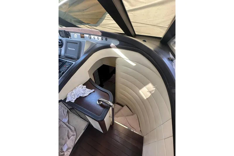 Romeo & Juliet Yacht Photos Pics Interior view of 2009 Azimut 86S yacht with elegant staircase and navigation equipment.