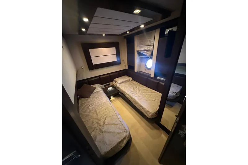 Romeo & Juliet Yacht Photos Pics Luxurious interior of 2009 Azimut 86S yacht with twin beds and modern decor.
