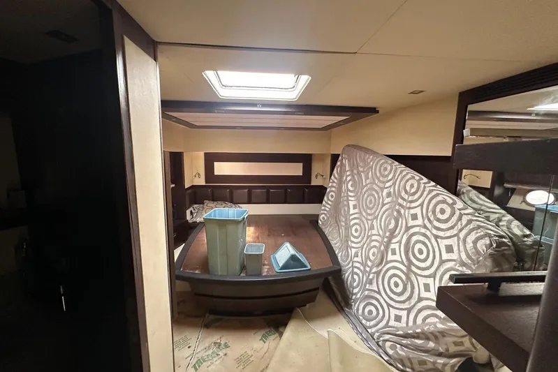 Romeo & Juliet Yacht Photos Pics Interior of 2009 Azimut 86S yacht with covered furniture and storage bins.