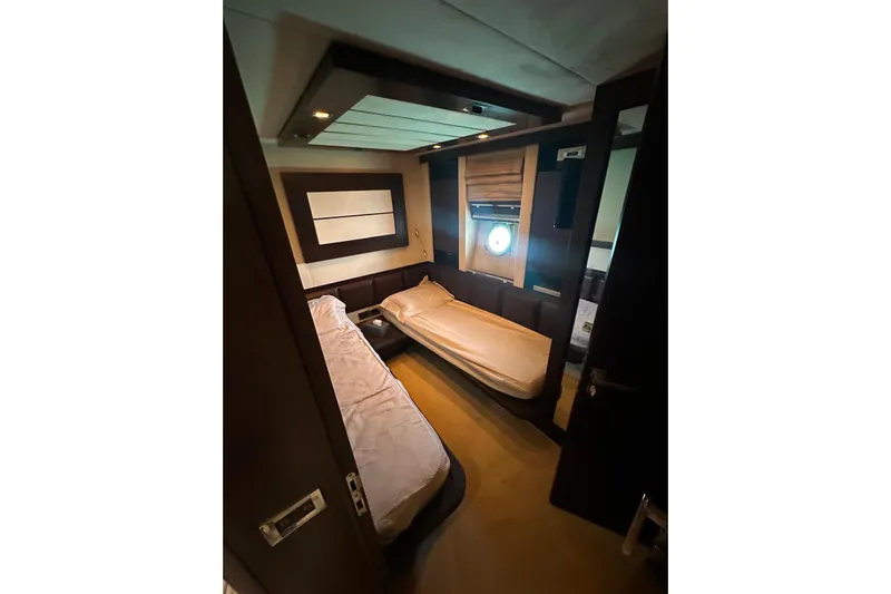 Romeo & Juliet Yacht Photos Pics Luxurious cabin interior of 2009 Azimut 86S yacht with twin beds and modern decor.