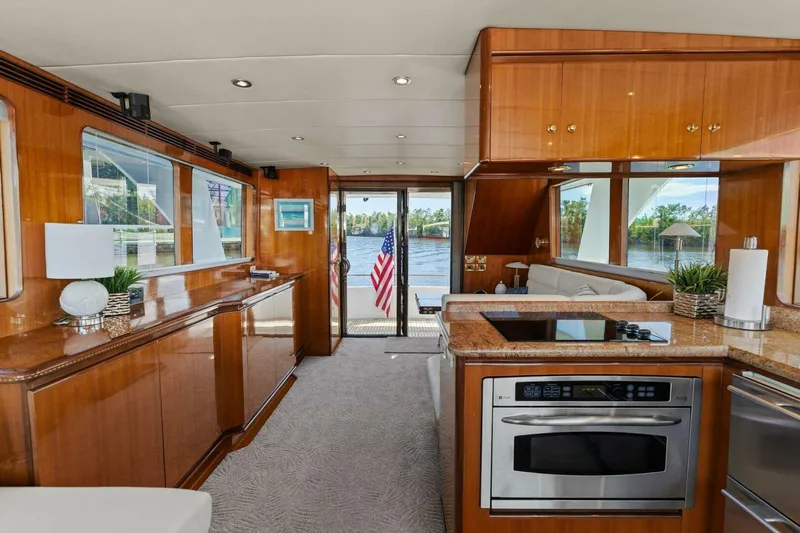 Sunshine And Happiness Yacht Photos Pics Luxurious yacht interior with modern kitchen and scenic water view.