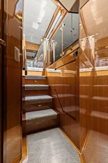 Sunshine And Happiness Yacht Photos Pics Wooden staircase with carpeted steps inside a 2008 Altima Sedan.