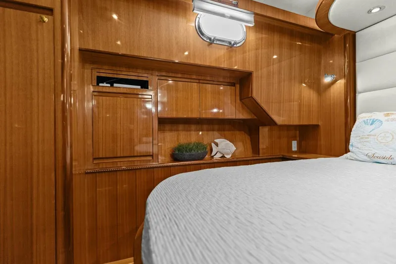 Sunshine And Happiness Yacht Photos Pics Luxurious wooden interior of a 2008 Altima Sedan, featuring a cozy bed and elegant decor.