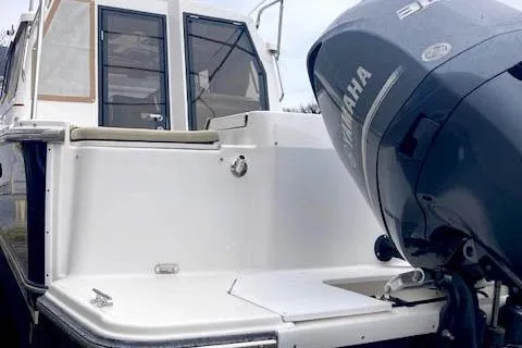  Yacht Photos Pics 2018 Ranger Tugs R-27 boat with Yamaha outboard motor, rear view.