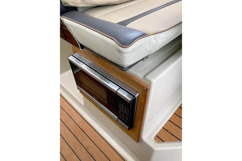  Yacht Photos Pics 2018 Ranger Tugs R-27 interior with microwave and cushioned seating.