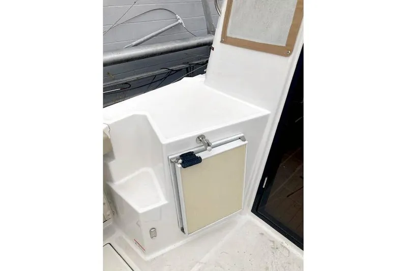  Yacht Photos Pics 2018 Ranger Tugs R-27 boat interior with compact storage compartment.