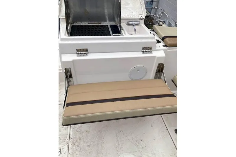  Yacht Photos Pics 2018 Ranger Tugs R-27 boat interior with foldable seat and compact sink.