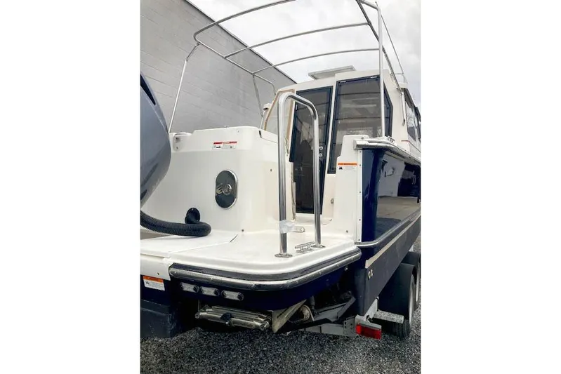  Yacht Photos Pics 2018 Ranger Tugs R-27 boat, rear view with swim platform and railing.