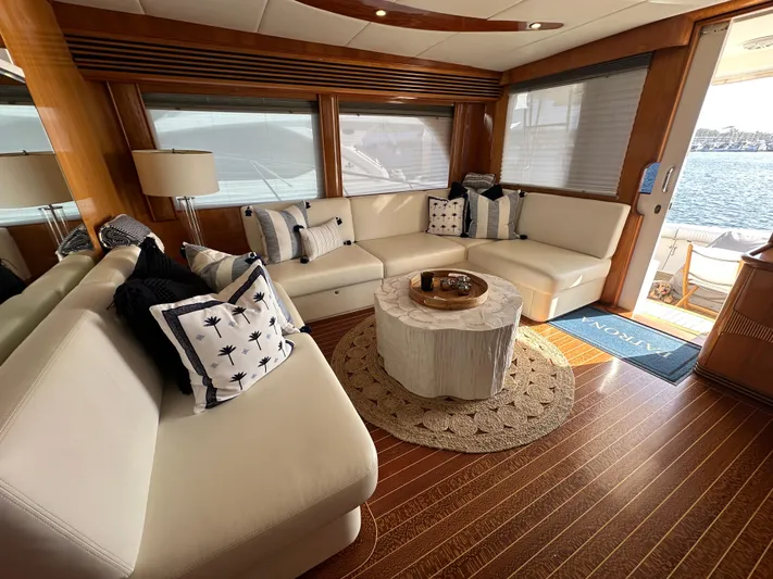 Patrona Yacht Photos Pics Luxurious interior of a 2000 Mikelson 61 Sportfisher yacht with elegant seating and decor.