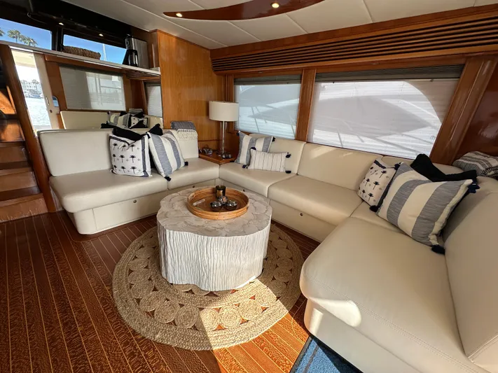 Patrona Yacht Photos Pics Luxurious interior of 2000 Mikelson 61 Sportfisher yacht with elegant seating and decor.