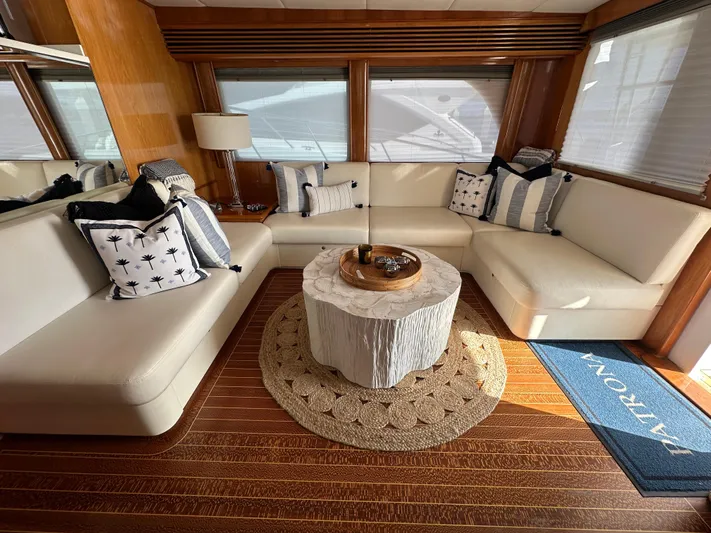 Patrona Yacht Photos Pics Luxurious interior of a 2000 Mikelson 61 Sportfisher yacht with elegant seating and decor.