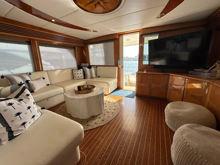 Patrona Yacht Photos Pics Luxurious interior of a 2000 Mikelson 61 Sportfisher yacht with elegant seating and decor.
