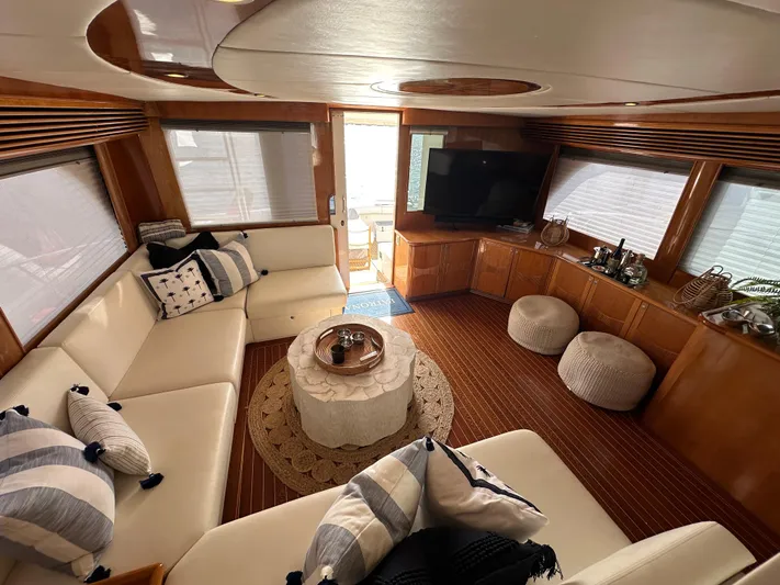 Patrona Yacht Photos Pics Luxurious interior of 2000 Mikelson 61 Sportfisher yacht with elegant seating and decor.
