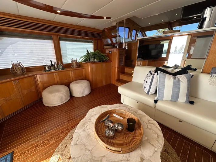 Patrona Yacht Photos Pics Luxurious interior of 2000 Mikelson 61 Sportfisher yacht with elegant wood finishes.