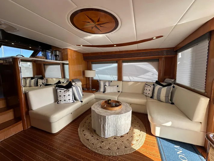 Patrona Yacht Photos Pics Luxurious interior of 2000 Mikelson 61 Sportfisher yacht with elegant seating and decor.