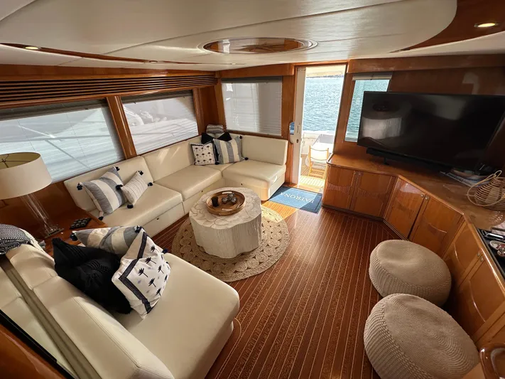 Patrona Yacht Photos Pics Luxurious interior of 2000 Mikelson 61 Sportfisher yacht with elegant seating and decor.