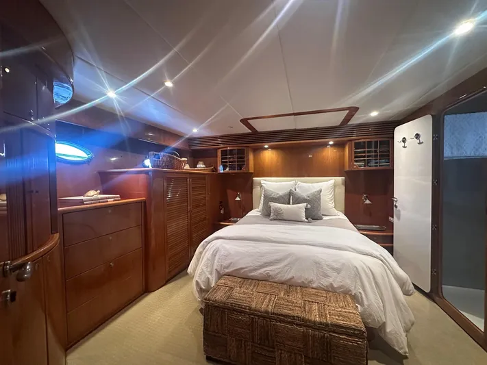 Patrona Yacht Photos Pics Luxurious cabin interior of 2000 Mikelson 61 Sportfisher yacht with elegant wood finishes.