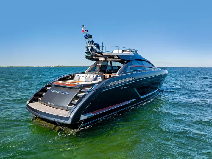 Arcadia Yacht Photos Pics Luxury 2020 Riva 66' Ribelle yacht cruising on open water.