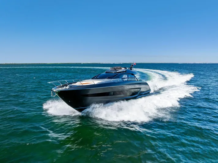 Arcadia Yacht Photos Pics Luxury 2020 Riva 66' Ribelle yacht cruising on open water.