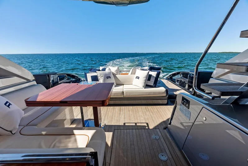 Arcadia Yacht Photos Pics Luxurious 2020 Riva 66' Ribelle yacht interior with ocean view and elegant seating.