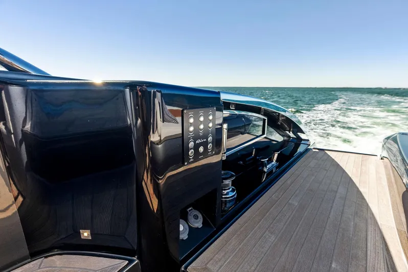 Arcadia Yacht Photos Pics Riva 66' Ribelle 2020 yacht cruising on open sea, sleek deck design.