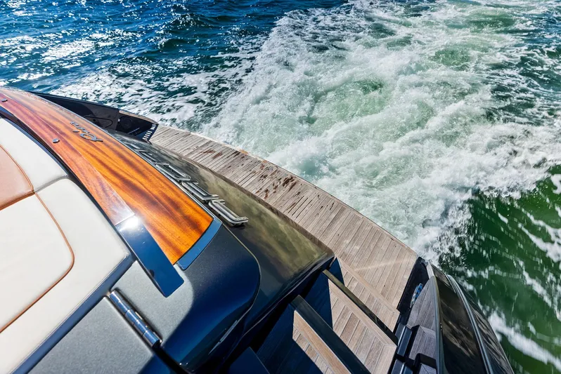 Arcadia Yacht Photos Pics Riva 66' Ribelle 2020 yacht cruising on vibrant blue waters.